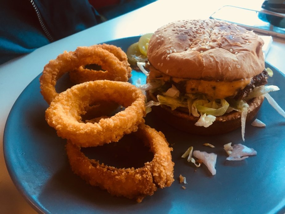  The S.F. Giant burger with cheddar cheese, fixins (no tomatoes because Drew turns into a Gremlin if he has them on a burger), and awesome cripsy, cooked-to-perfection fried onion rings 